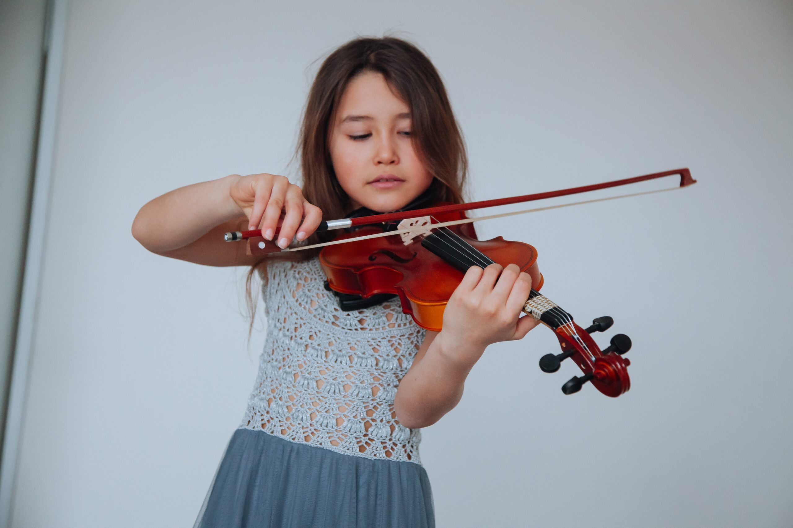 Children with music instruments including a violin